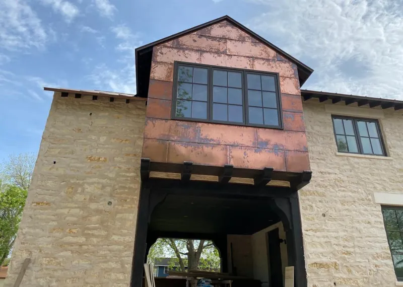 Copper metal panel facade on a stone building for Skylight Installation in Goodyear